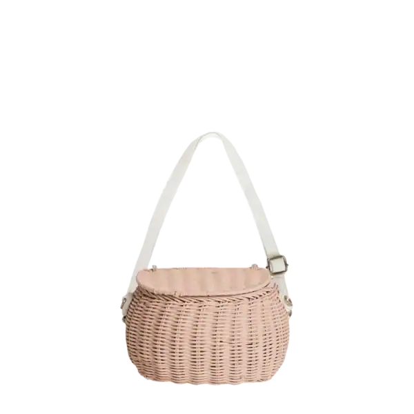Wicker handbag with pink fabric top and white strap for baby spa accessories.